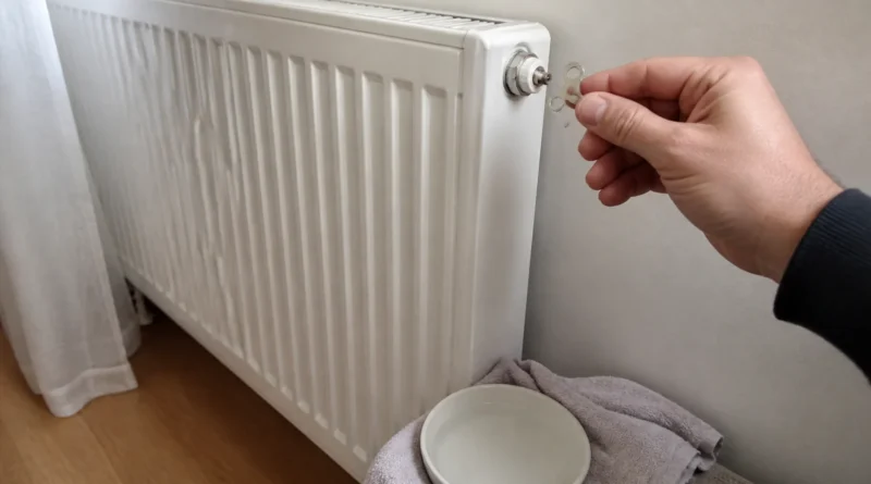 Příprava bílého deskového radiátoru k odvzdušnění pomocí klíčku